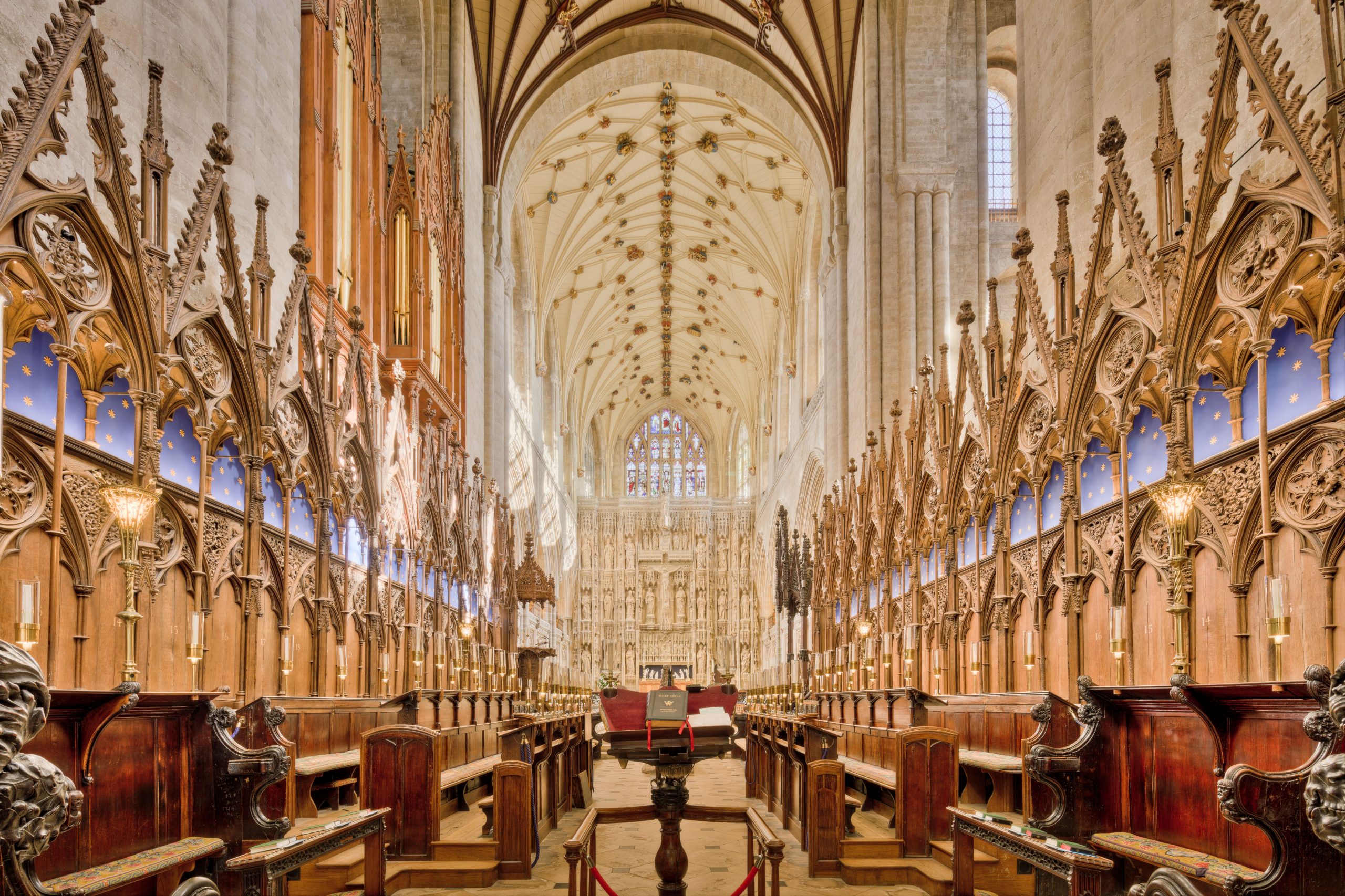 Explore the intricate Gothic architecture inside Winchester Cathedral showcasing stunning arches and carvings.
